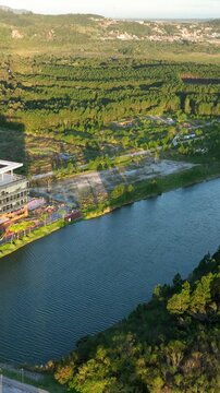 Artificial Lake Integrated with Modern Technology Buildings and Green Infrastructure in Florian&oacute;polis, Brazil. Establishing Shot. Aerial View.