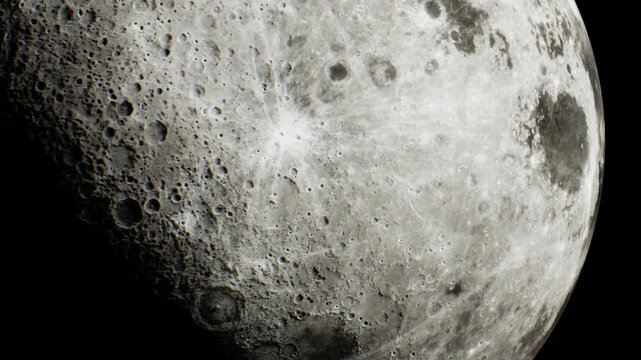 The moon is shown in detail with visible craters and surface textures against a black sky. This scene is captured on a clear night, providing a close up view of the lunar surface.