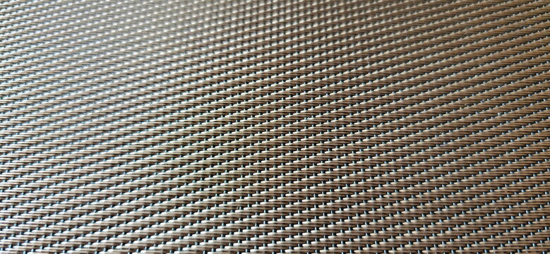 Woven PVC-Vinyl placemats are made from PVC plastic woven with polyester fibers. The synthetic fibers are interwoven to create patterns that mimic natural weaves or metallic diagonal designs
