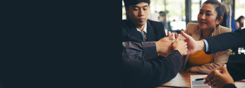 Group of businesspeople celebrating successful deal with team, showing thumbs-up gestures and teamwork during business meeting, with happy corporate employees working together-banner
