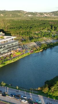 Artificial Lake Integrated with Sustainable Infrastructure, Modern Buildings and Preserved Green Landscape in Florian&oacute;polis, Brazil. Establishing Shot. Aerial View.