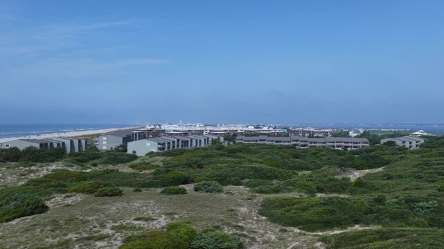 Atlantic Beach, NC aerial view natural sand dunes beside hotels and resorts on Crystal coastline