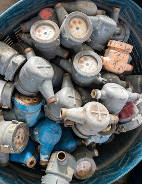 Pile of Old Used Brass Water Meters