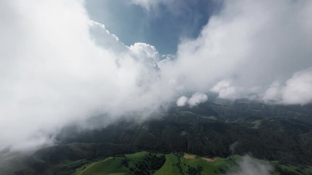 Aerial view of mountain landscape through clouds