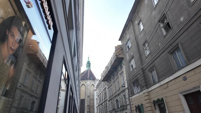 Aesthetic cinematic slow motion view of the Kirche am Hof dome from Steindlgasse Vienna