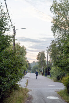 man walking on the misty road in the city, nacka,sverige,sweden,stockholm,summer