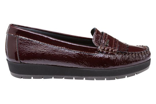 Dark burgundy patent leather womens loafer isolated on white background. Casual platform moccasin side view