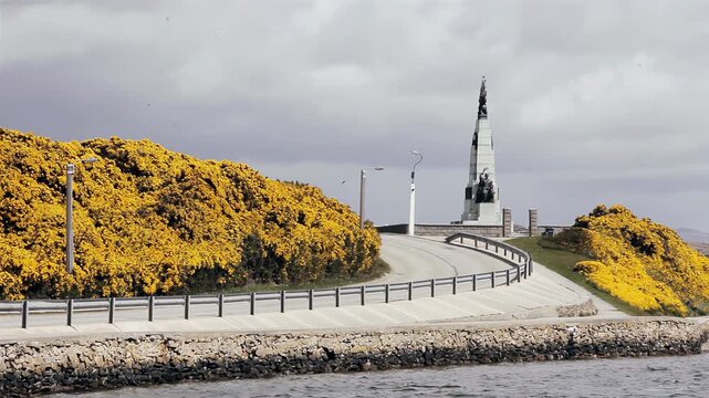 Memorial Tower Architecture And Roadway With Blooming Bushes In Stanley Falkland Islands (Islas Malvinas) - 4K