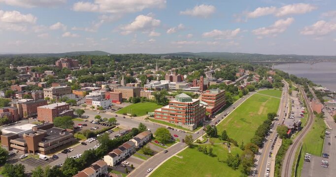 Newburgh riverfront wide pan with houses, college, marina and bridge in New York
