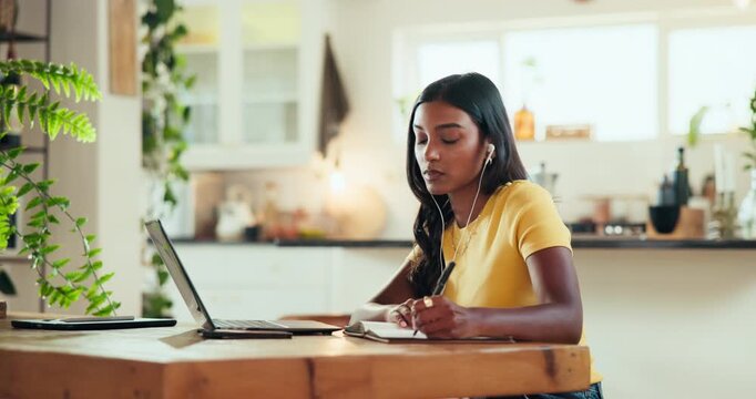Woman, writing and laptop in home for studying, creative assignment and research with music. Design student, earphones and notes in book for learning, online course and productivity in living room