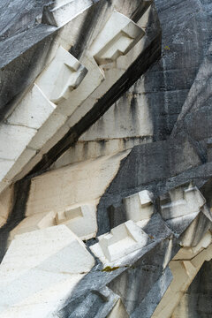 Tjentiste, Republika Srpska, Bosnia and Herzegovina - 16 June 2025: View of the abstract concrete forms of the Tjentiste War Memorial, featuring sharp geometric angles and weathered stone textures.