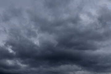 Obraz premium Dark sky with rain clouds, autumn rainy weather, storm clouds in the sky, dark dramatic clouds with rain clouds, storm,