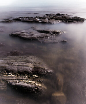 Wembury Coastline With The Tide Coming In In Long Exposure