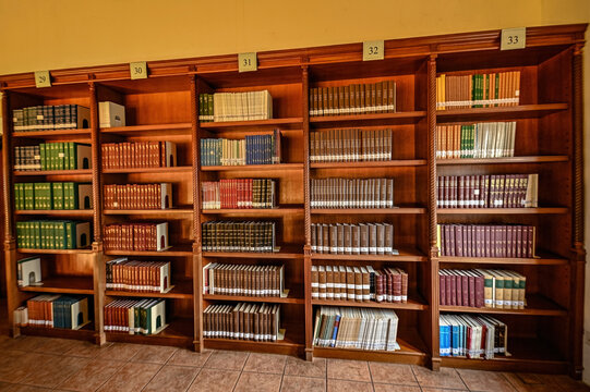 Old wooden shelves with antique books in Syed Muhammad Naquib al-Attas Library, ISTAC Kuala Lumpur Malaysia