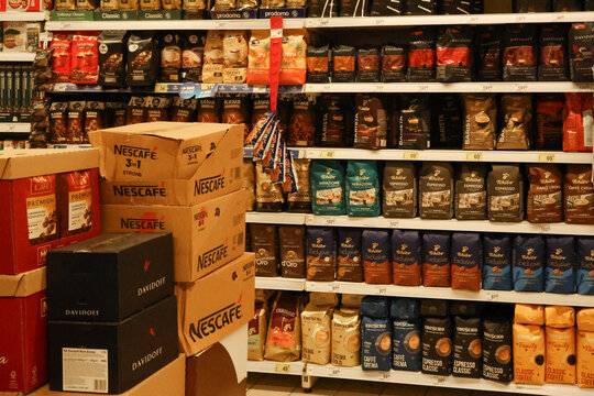 Warsaw, Poland, 20 August 2026. Various brands of coffee for sale in a supermarket aisle, featuring packaged bags and boxed items