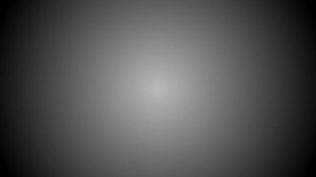 Soft gray radial gradient on a dark black background with smooth central illumination and subtle vignette for minimalist abstract design compositions
