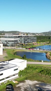 Technology and Innovation Complex Surrounded by Forest, Lakes and Green Landscape in Northern Florian&oacute;polis, Brazil. Aerial View.