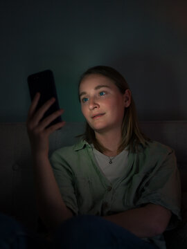 Woman immersed in social media on smartphone