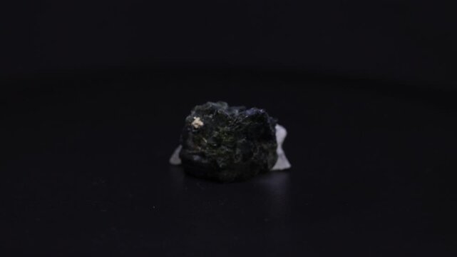green tourmaline mineral from Brazil with black background