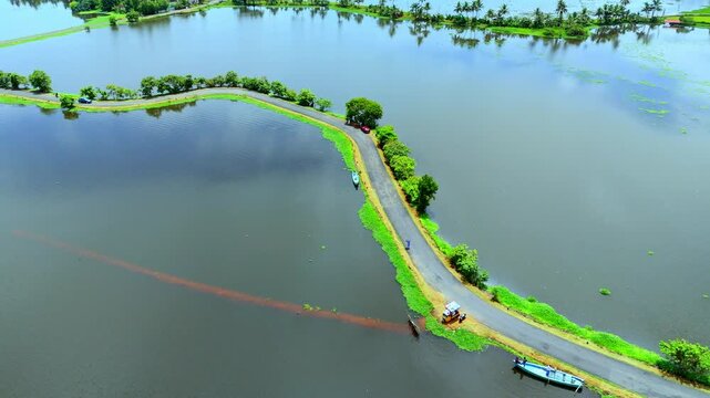 Iconic landscape of Veliyanad in Kerala&rsquo;s Kuttanad region flooded polder fields (padasekharams),Kuttanad&rsquo;s below-sea-level ecosystem, monsoon waterlogging,ural transport, backwater scenery