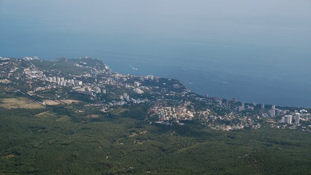 Scenic panoramic view from Ai-Petri mountain summit to Yalta city.