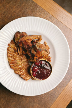 Elegant Gold Duck Dish Served On A White Plate in restaurant. Top view
