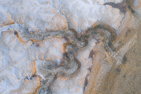 Aerial view of the unique geological formations and dry cracked earth patterns of Gora Bokty, Karakiya District, Mangystau Region, Kazakhstan.