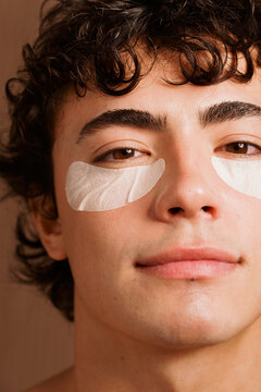 Man Using Under-Eye Patches at Home for Skincare