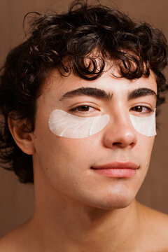 Man Applying Skincare Patches at Home to Refresh His Skin