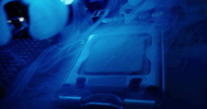 Fire and overheating with smoke of cpu processor and socket on motherboard in electronics lab under blue metallic lighting, probe macro view.