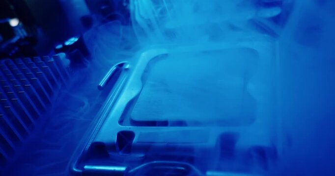Fire and overheating with smoke of cpu processor and socket on motherboard in electronics lab under blue metallic lighting, probe macro view.