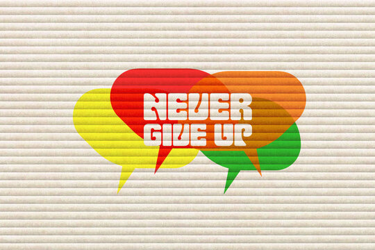 Never give up colorful quote on bright striped wall background