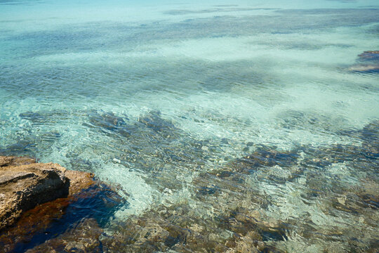 Crystal clear turquoise water and shallow seabed at Favignana island in Sicily Italy
