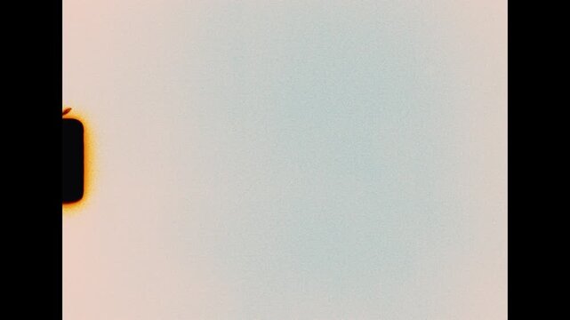 Authentic Super 8 film leader rolls with sprocket perforation hole and subtle grain on an overexposed light background