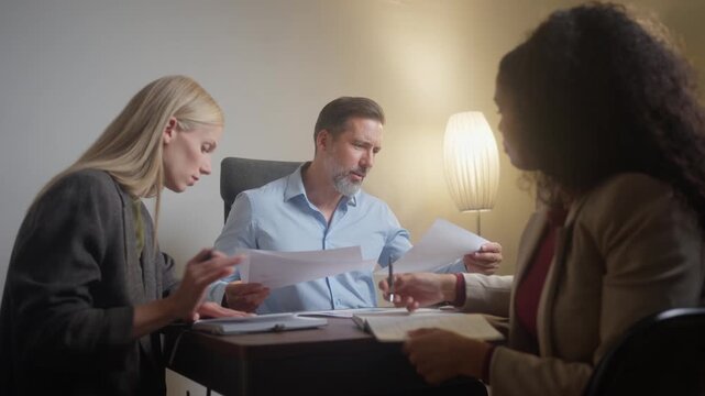 Frustrated manager criticizing employees during tense meeting about business performance and team failure
