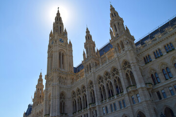 Fototapeta premium Vienna City Hall towers rising into the blue sky in backlight