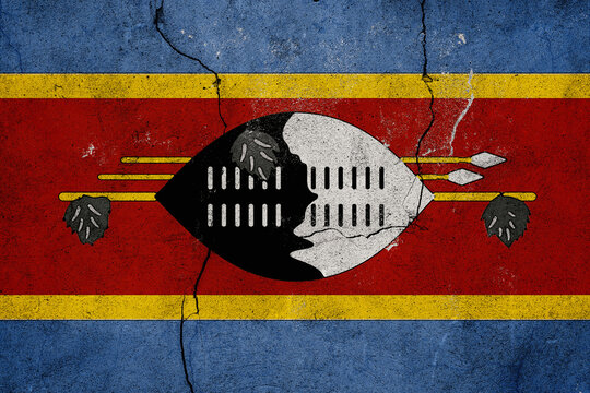 Eswatini Flag Grunge Texture Painted on a Cracked Wall Symbolizing National Identity and Resilience