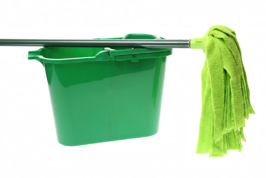 Vibrant green mop and plastic bucket for floor cleaning