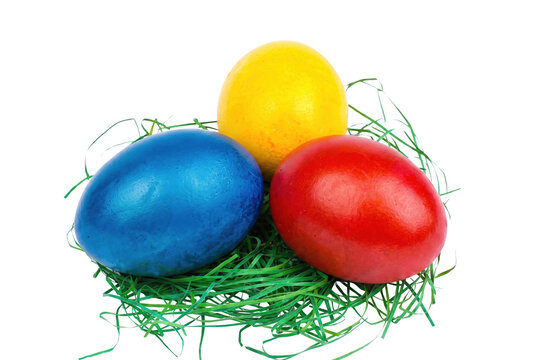 Vibrant Primary Colored Easter Eggs Resting on Green Grass