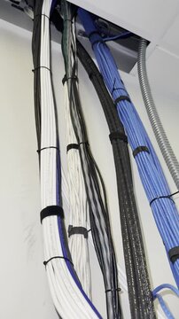 Vertical Cable Bundle Secured Along Wall