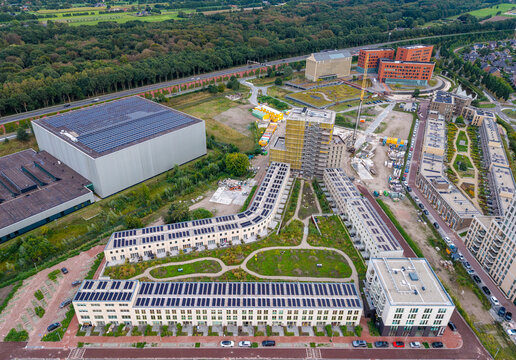 Aerial view of high-rise housing development and modern residential complex between highway a28 and train station amersfoort vathorst in the netherlands