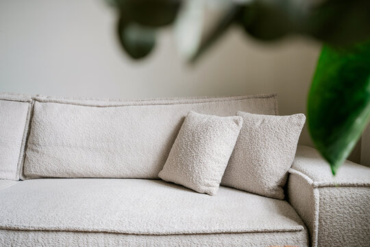 Modern living room with white couch in a cozy apartment setting