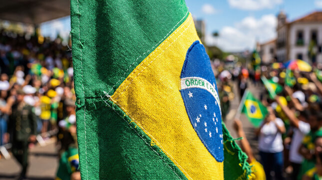 Brazilian flag waving with crowd