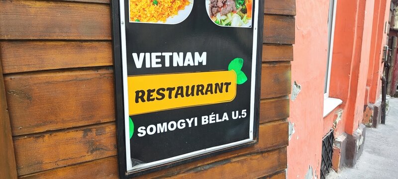 Budapest, Hungary - 26 June 2024, Restaurant sign displays Vietnam food options and its address in Budapest Hungary