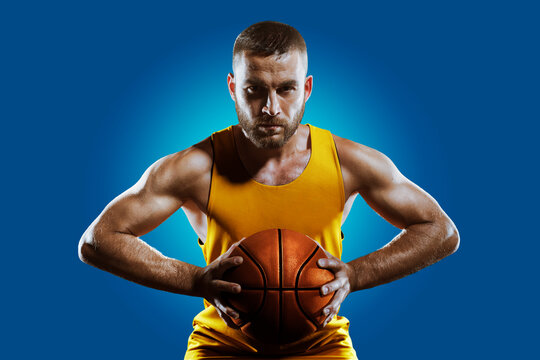 Sports concept. Professional athlete isolated on a blue background. Athlete in action. Sport