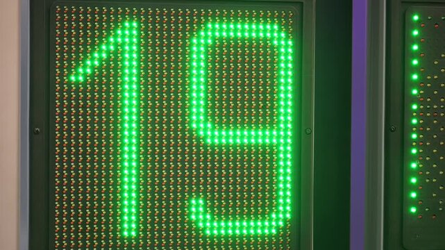 Digital display shows number 21. Then changes to 17. Finally shows 16. Bright green LED lights form digits