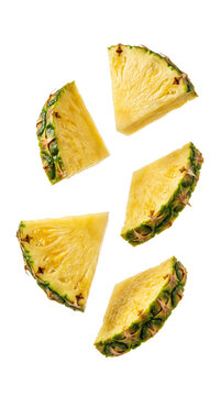 Fresh vibrant pineapple slices floating midair showcasing juicy yellow texture and green skin patterns captured in sharp high resolution on transparent background