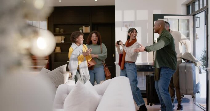Diverse friends reacting to open door, welcoming guests, taking selfie in entryway with suitcases