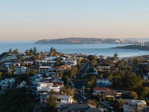 Aerial view of residential houses and streets in the coastal suburb of Dee Why, New South Wales, Australia.