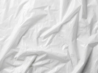 Obraz premium A close up view of white crinkled plastic sheet with soft shadows